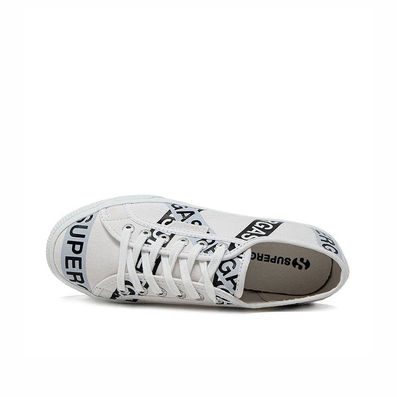 White canvas low-top sneakers with lace-up front, showing interior and side tape