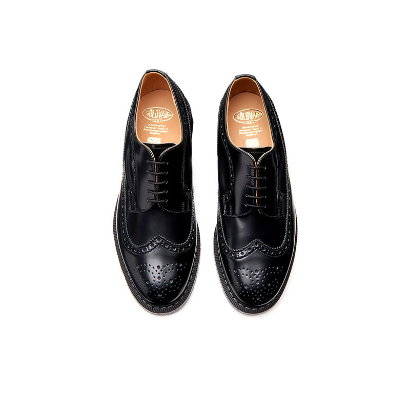 Black leather brogue lace-up shoes, top view with perforated toe and lace-up front