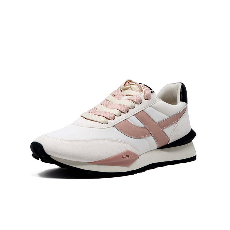 Women’s white sneakers with blush pink panels, lace-up front, and black rubber sole