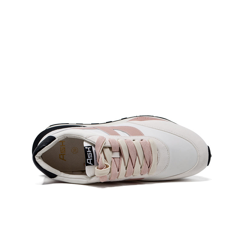 Women’s white lace-up sneakers with blush pink laces and visible interior lining