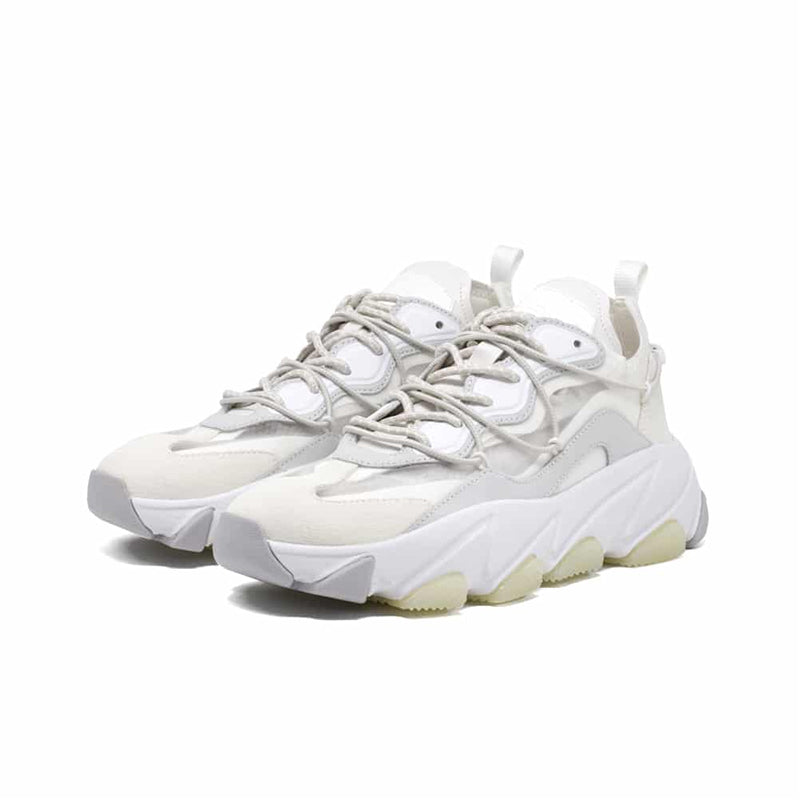 Women's white leather sneakers front view with lace-up and oversized sole