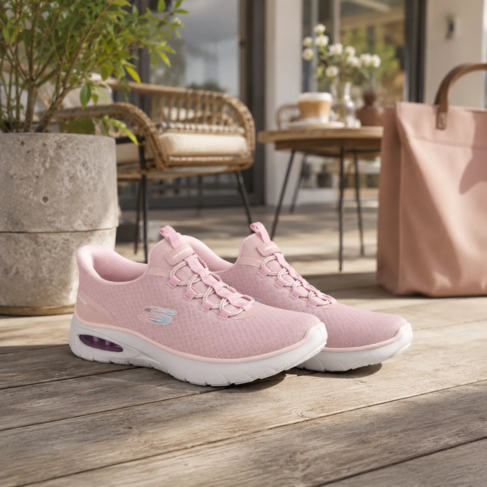Pink Skechers slip-on sneakers, side-by-side view with lace-up front and air sole