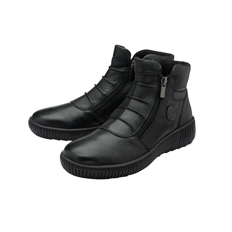 Black leather ankle boots with side zipper and molded upper panels, chunky tread sole.