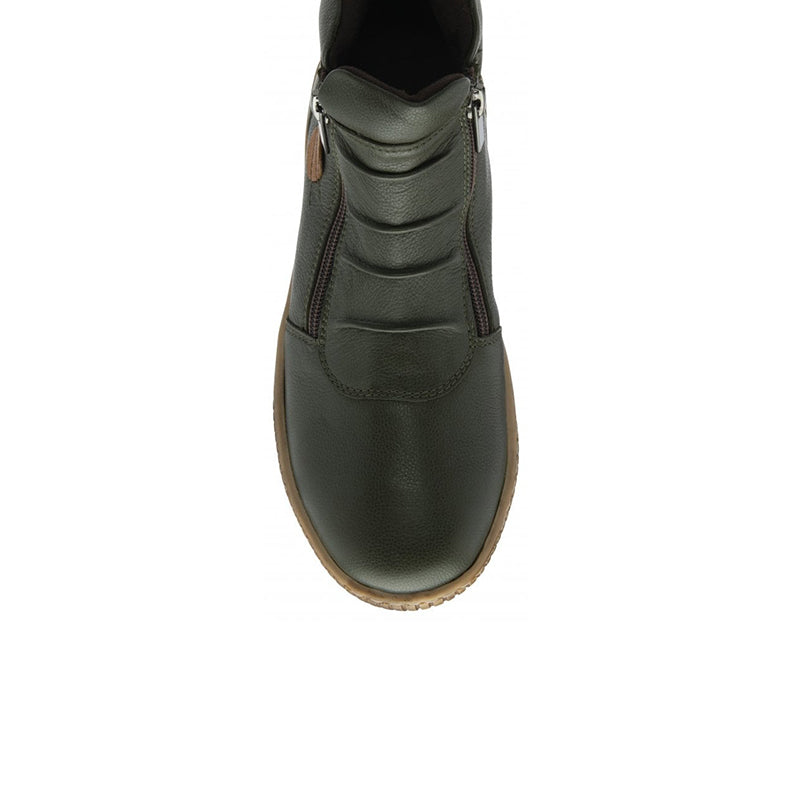Dark green leather ankle boot upper close-up with side zipper and tan accent at collar.
