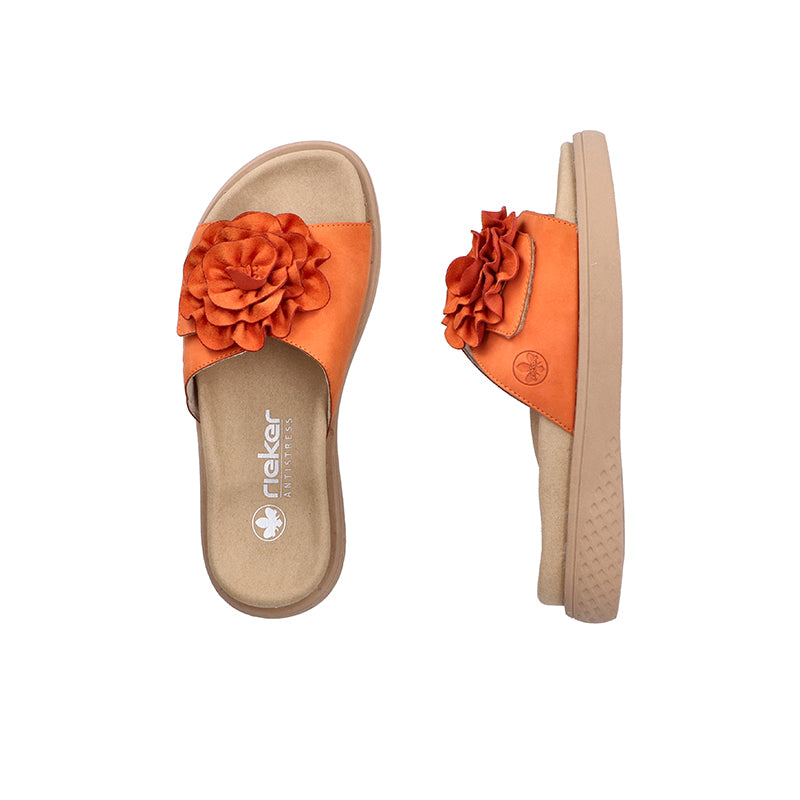 Pair of orange open-toe slide sandals with rosette applique and beige lining