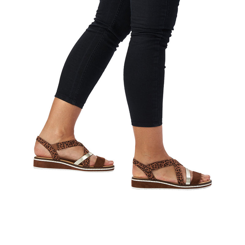 Brown leopard-print women's sandals with silver strap details and low platform sole