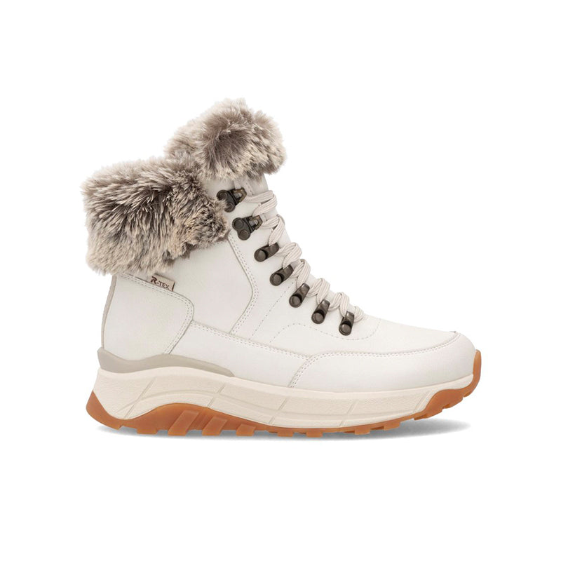 White winter snow boot with faux fur cuff, lace-up, and chunky gum-colored sole.