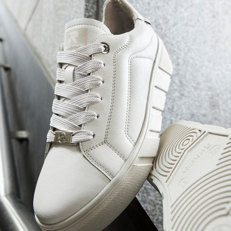 White leather sneaker upper with lace-up closure and metal eyelet detail