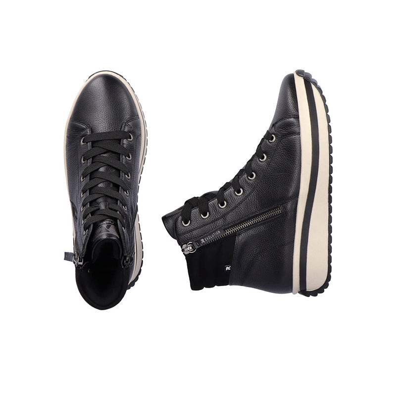 Black winter boots pair, lace-up uppers with side zipper and chunky platform sole