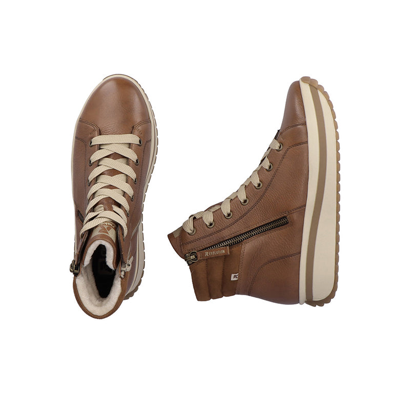 Brown winter boots pair, lace-up uppers with side zipper and chunky platform sole