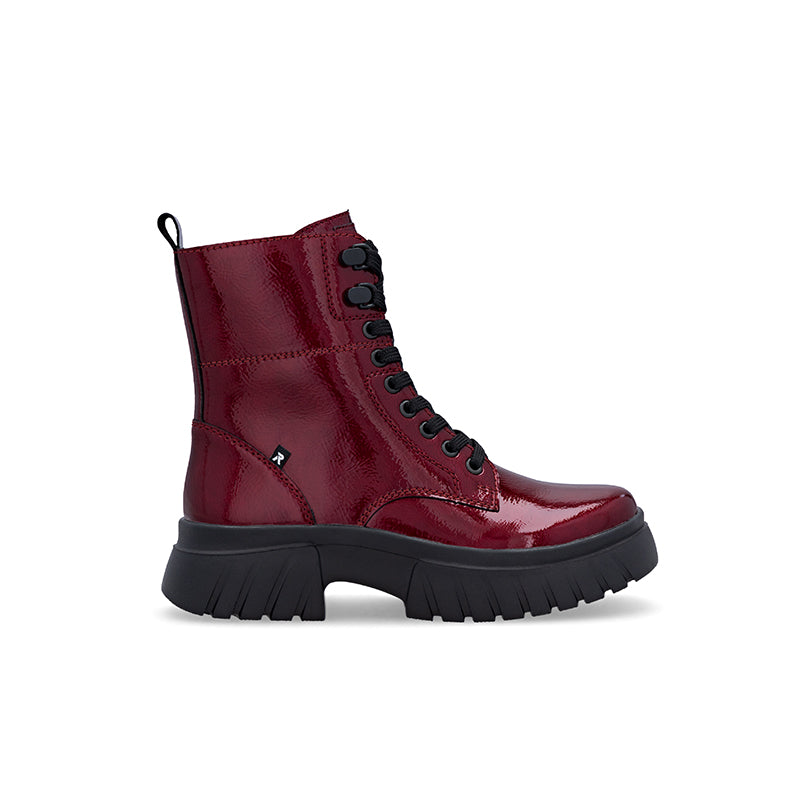 Dark red glossy leather ankle boots with black lace-up and thick tread sole