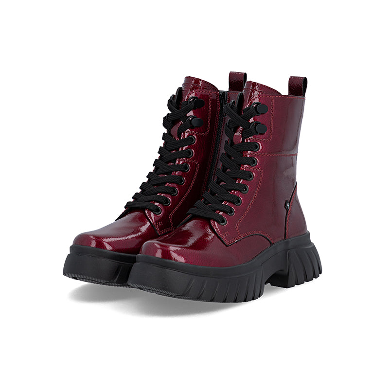 Dark red glossy leather lace-up boots with chunky sole and pull tab