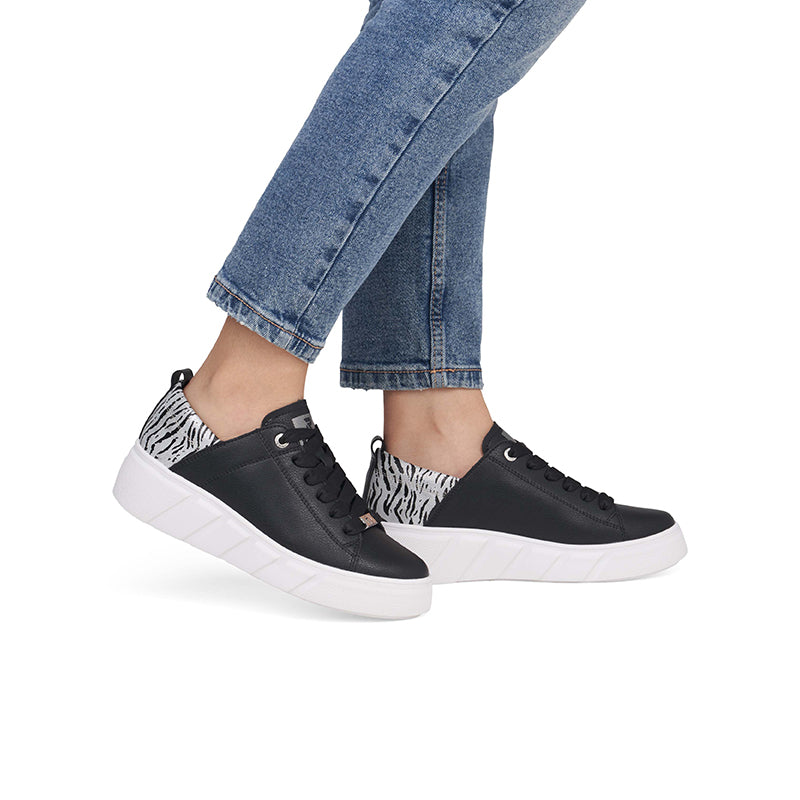 Women’s low-top lace-up sneakers in black with zebra side panels and white sole