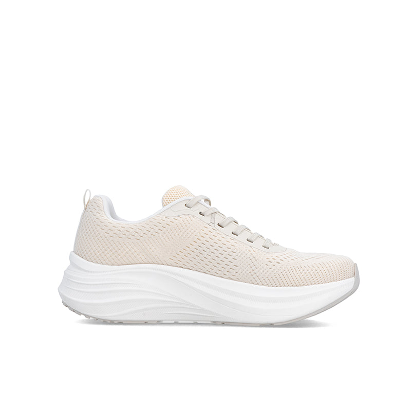 Beige knit lace-up sneaker with cushioned white sole, rear three-quarter view