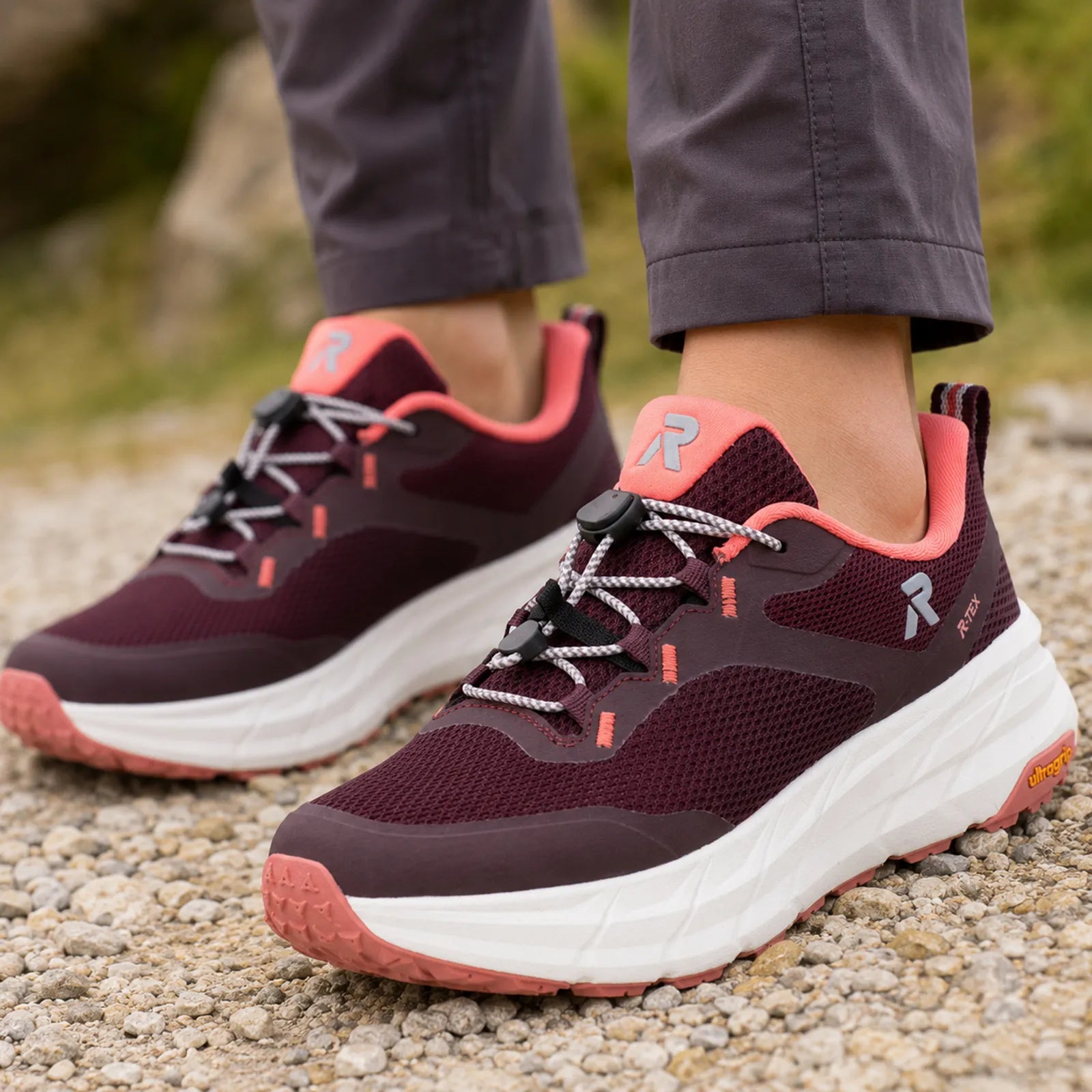 Rieker Kaweka women's red trekking trainers with quick lace fastening, on-foot walking view with outdoor styling