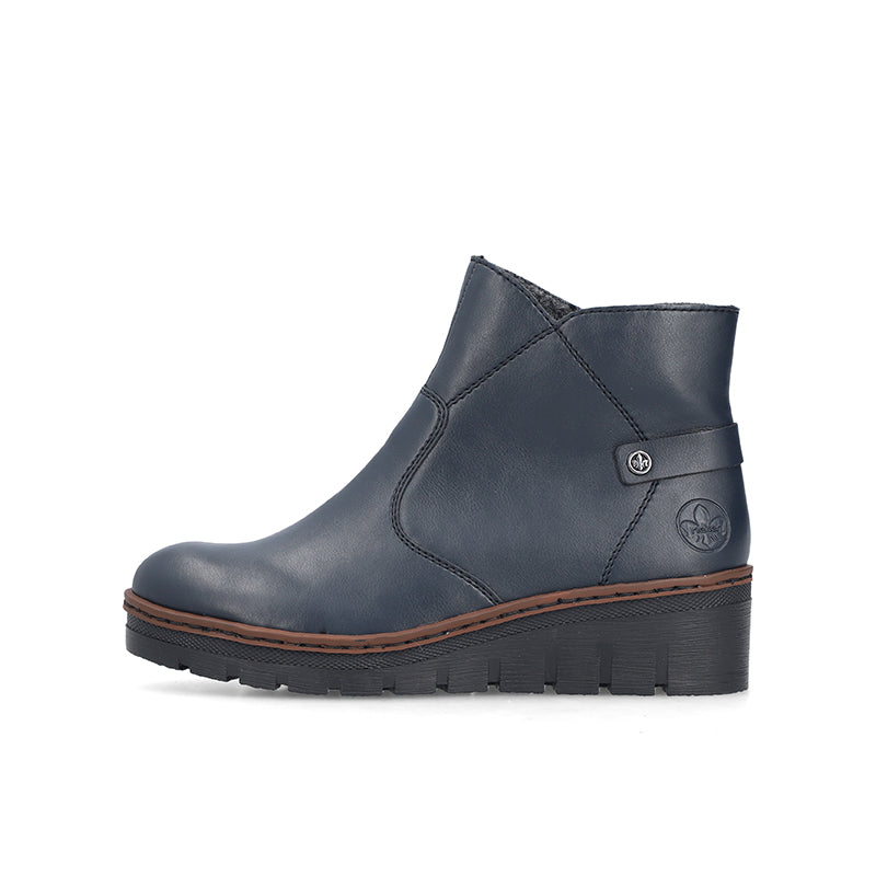 Women’s blue ankle boot with side zip, cushioned upper and rugged lug sole