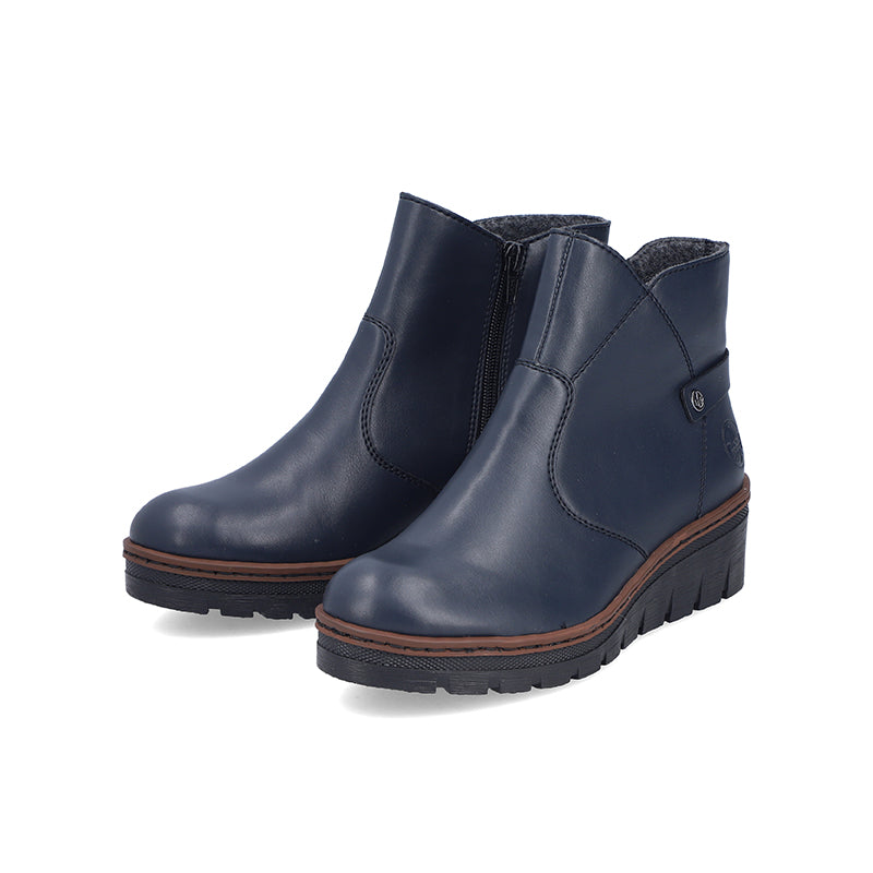 Women’s blue ankle boots pair with side zip and rugged lug sole