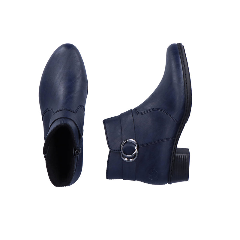 Blue ankle boots with circular buckle strap and padded collar