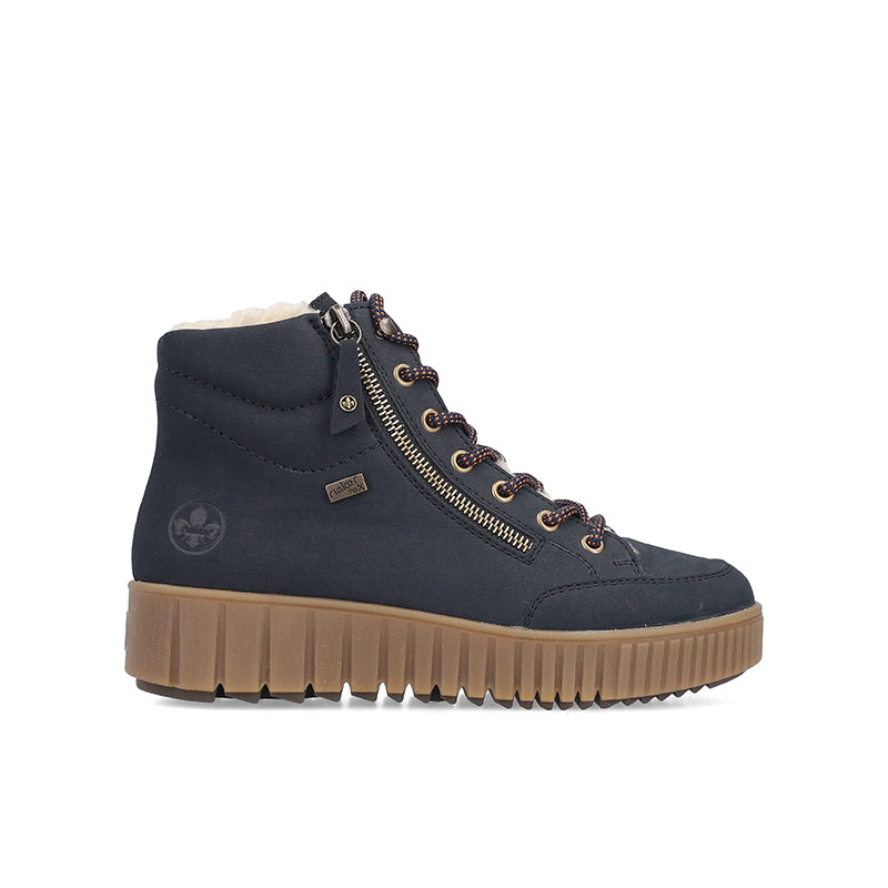 Blue ankle boots with side zip, lace-up front, padded collar, and rugged tan sole