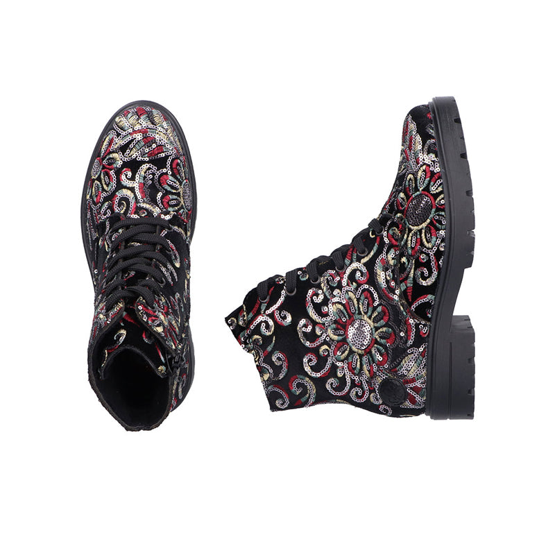 Women’s ankle boots with black multicolor paisley, side zip, and chunky lug sole.