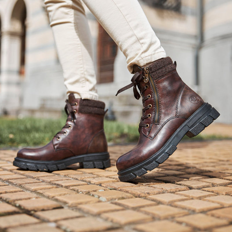 Brown lace-up winter boots with side zipper and thick rubber tread sole
