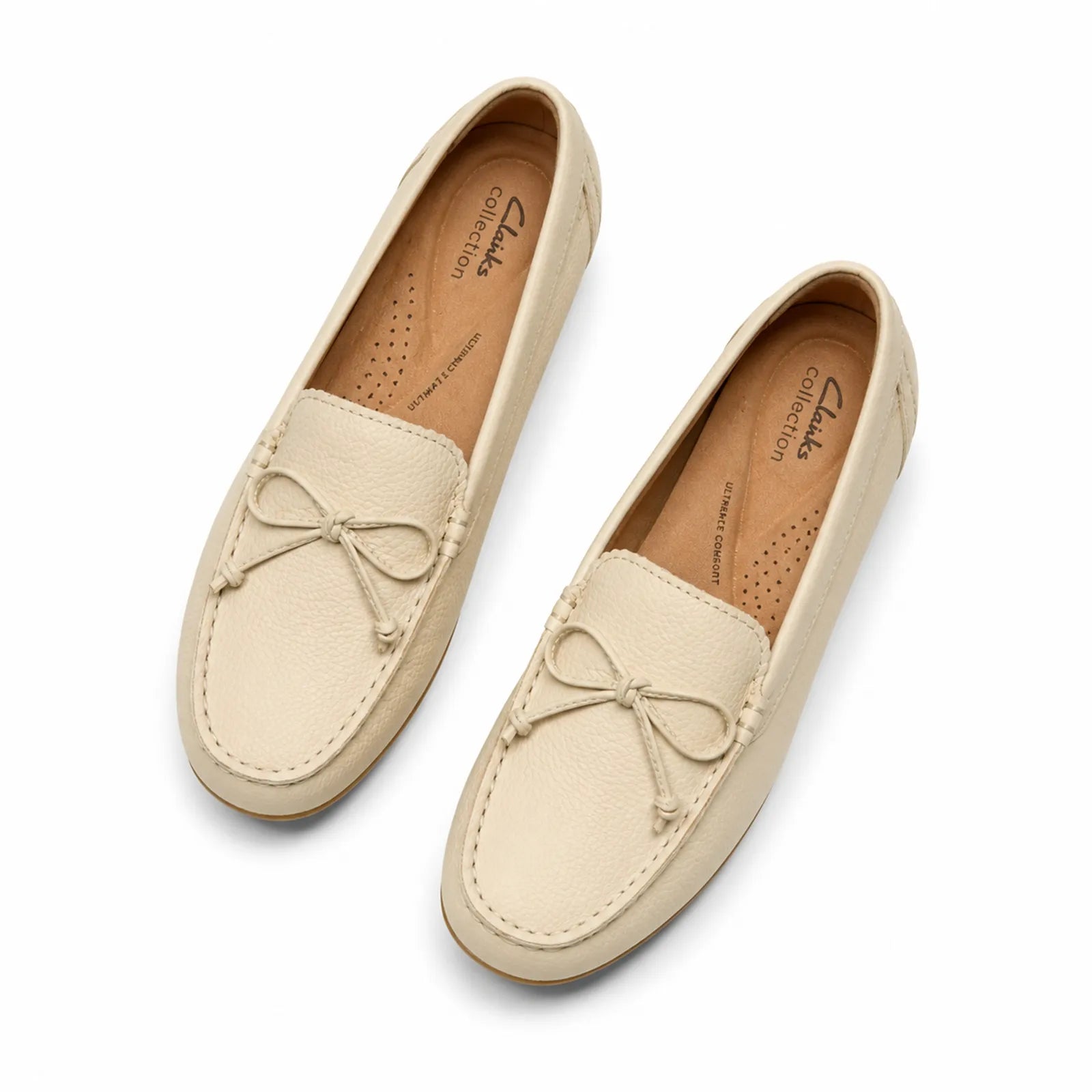 Side view of Clarks Elliotte Sail women's cream leather loafers with flexible TPR sole