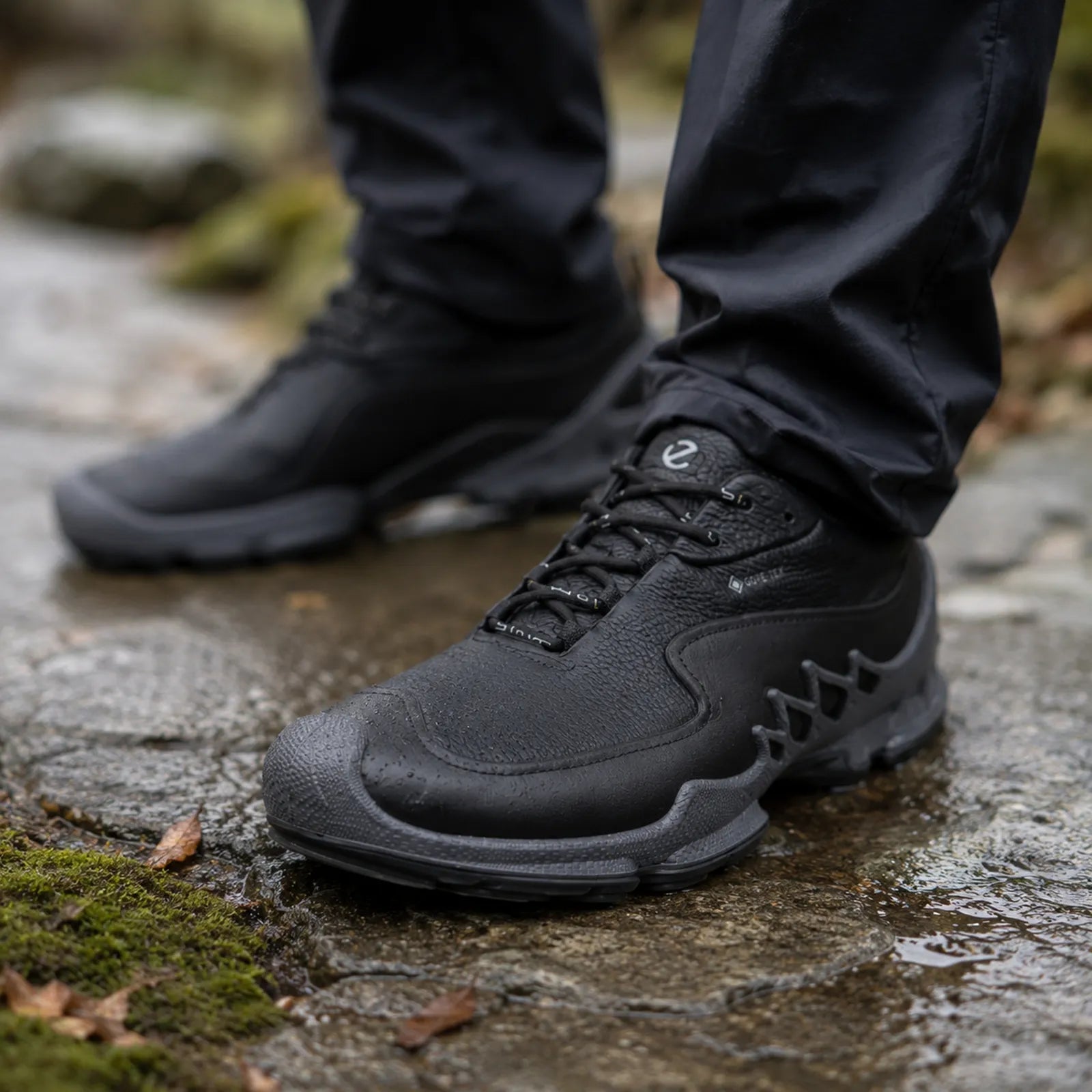ECCO Biom Aex black leather walking sneakers shown on foot for everyday comfort